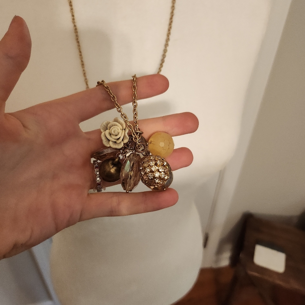 Gold chain necklace with lots of charms